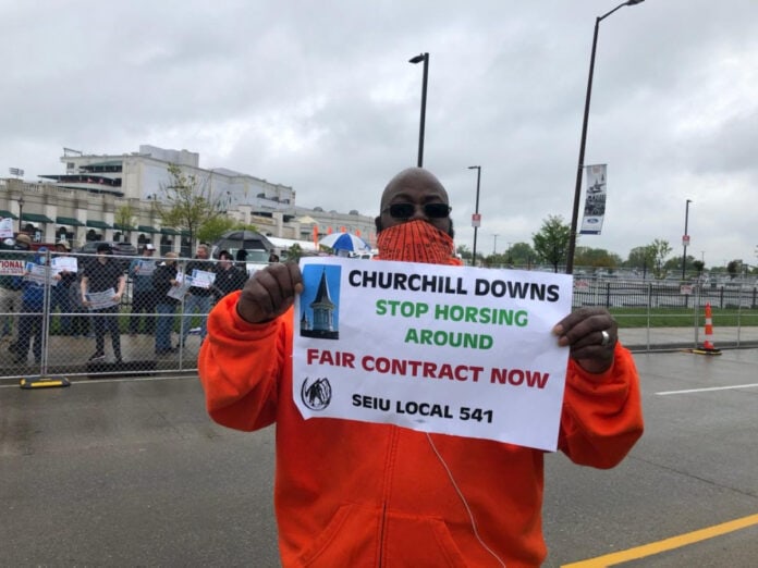 man holding protest sign