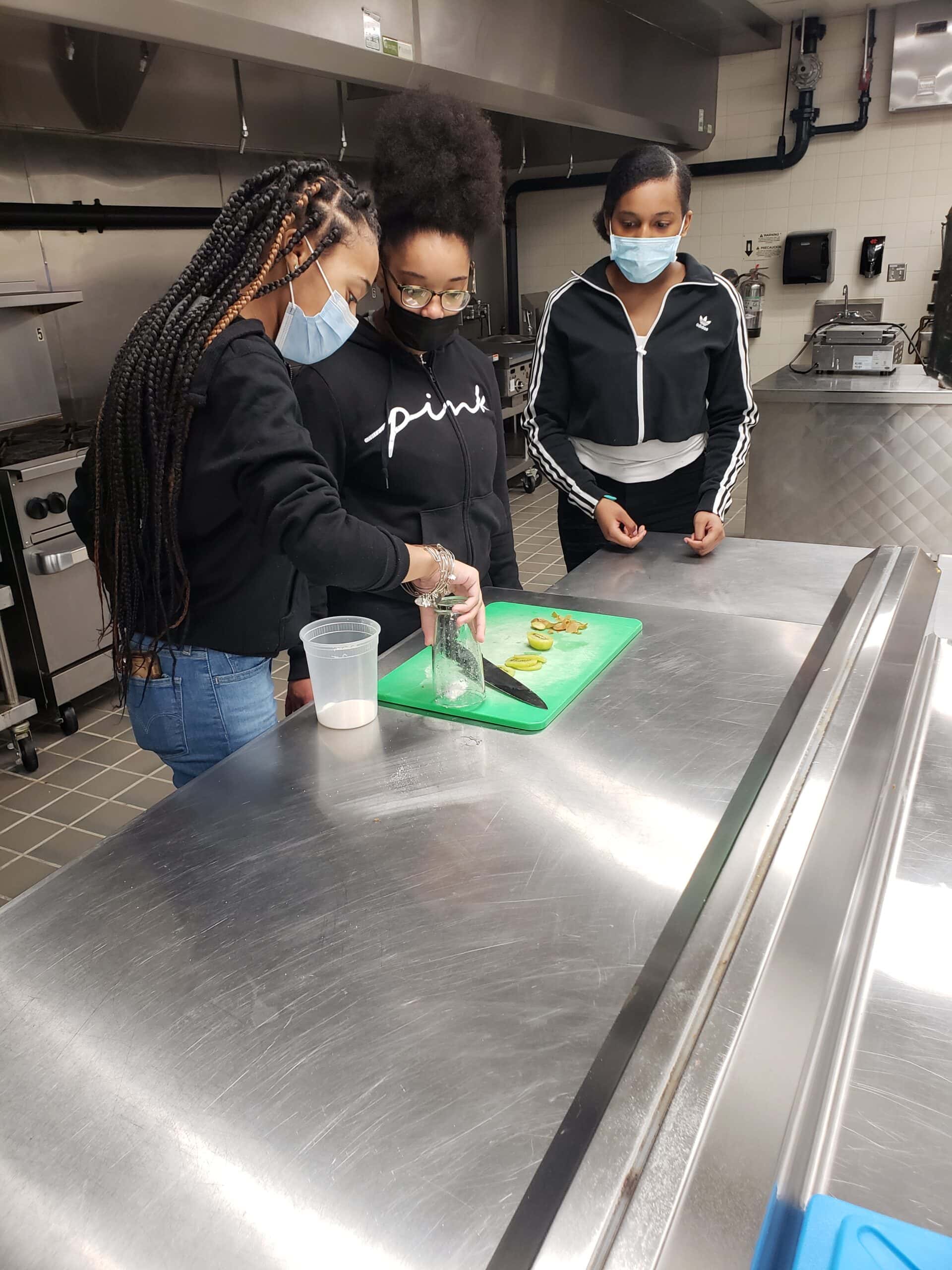 students work in kitchen