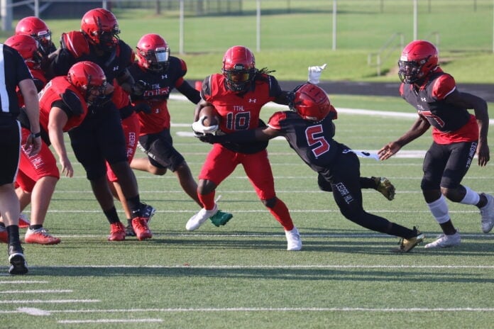 football player getting tackled