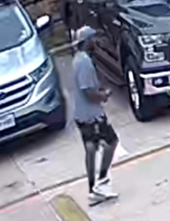 Black male standing in parking lot