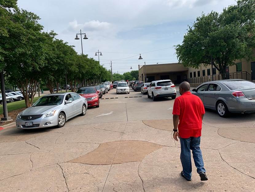 Man directs traffic at DeSoto City Hall