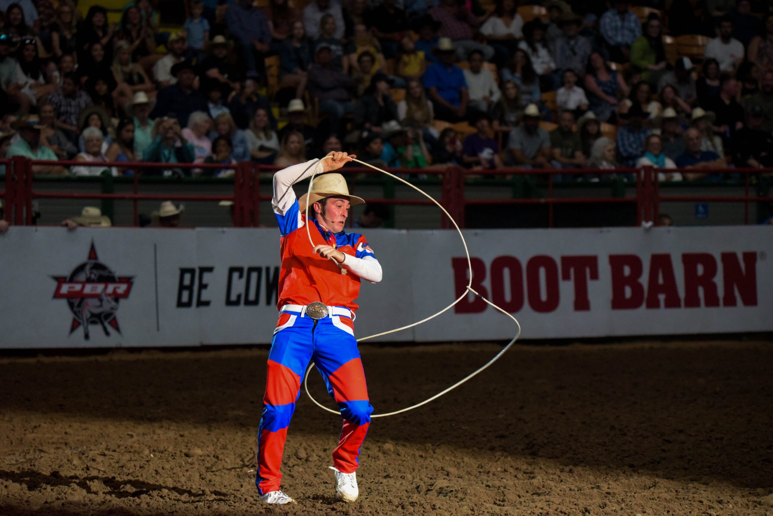 cowboy with lasso in arena