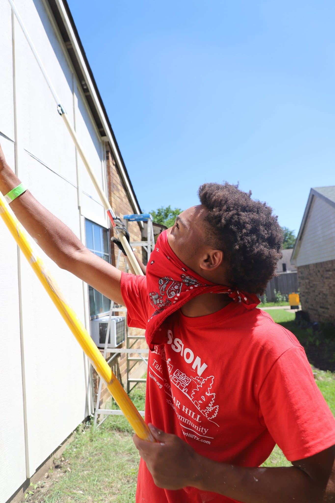 young man painting house