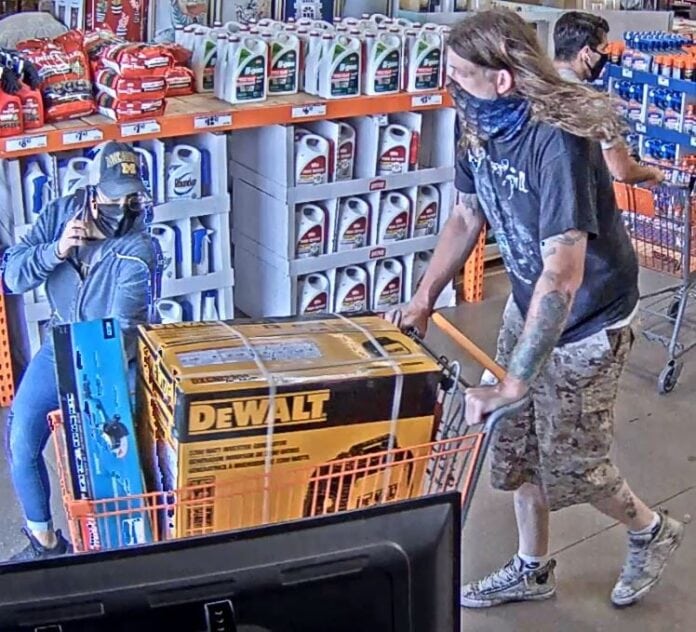 man with shopping cart of tools