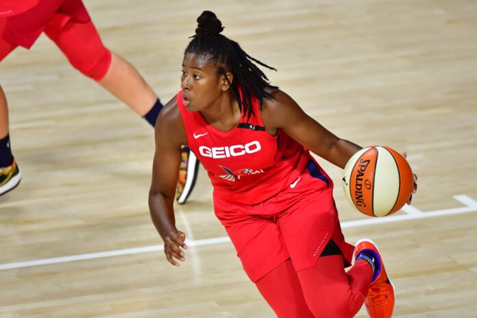 Ariel Atkins dribbling basketball