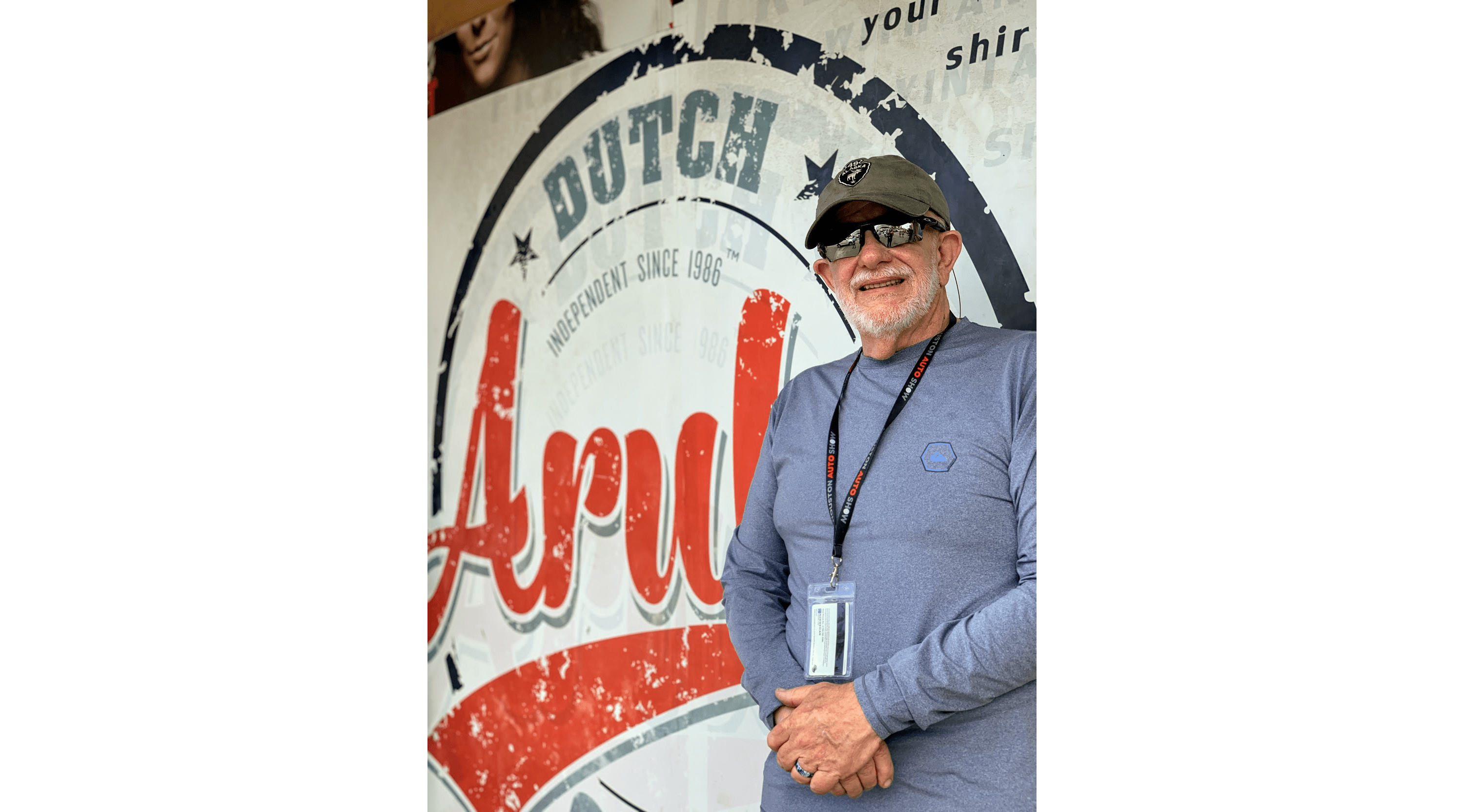 man in front of aruba sign