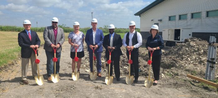 group of people with shovels