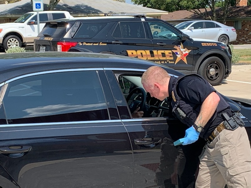 police officer by car