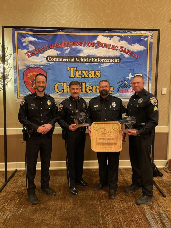 four police officers standing together