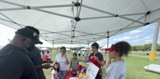 Cedar Hill ISD Back to School Rally Event Was Successful people under tent