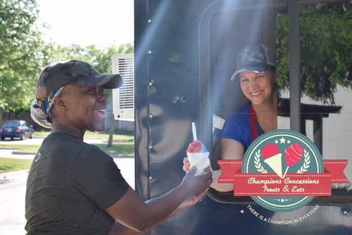 Champions concessions lady getting snow cone at food truck