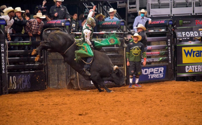 Cooper Davis from Jasper Texas wows the crowed as he hangs on the bull for 8 seconds Davis rising a bull