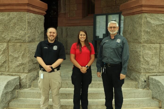 Ellis County employees on steps of courthouse