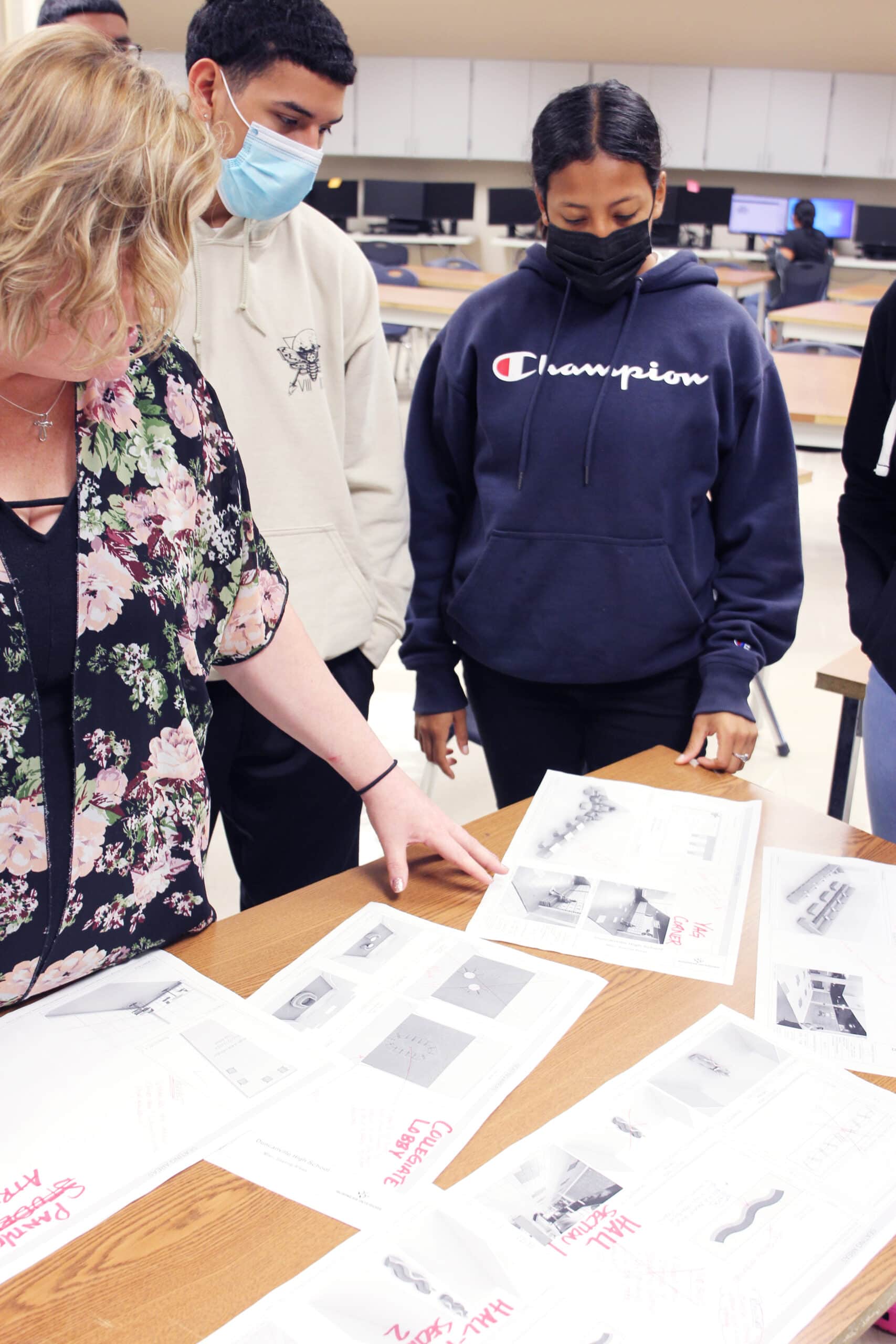 students standing around sketches