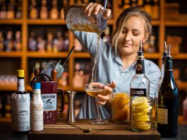 female bartended pouring drink