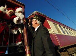 train conductor with Santa Claus