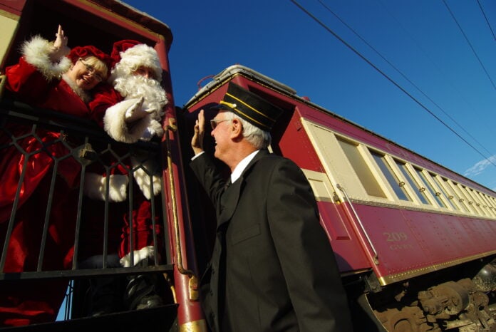 train conductor with Santa Claus