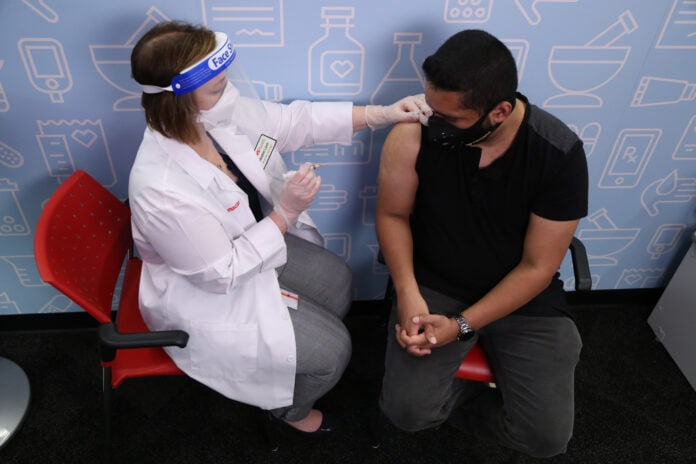 nurse giving flu shot