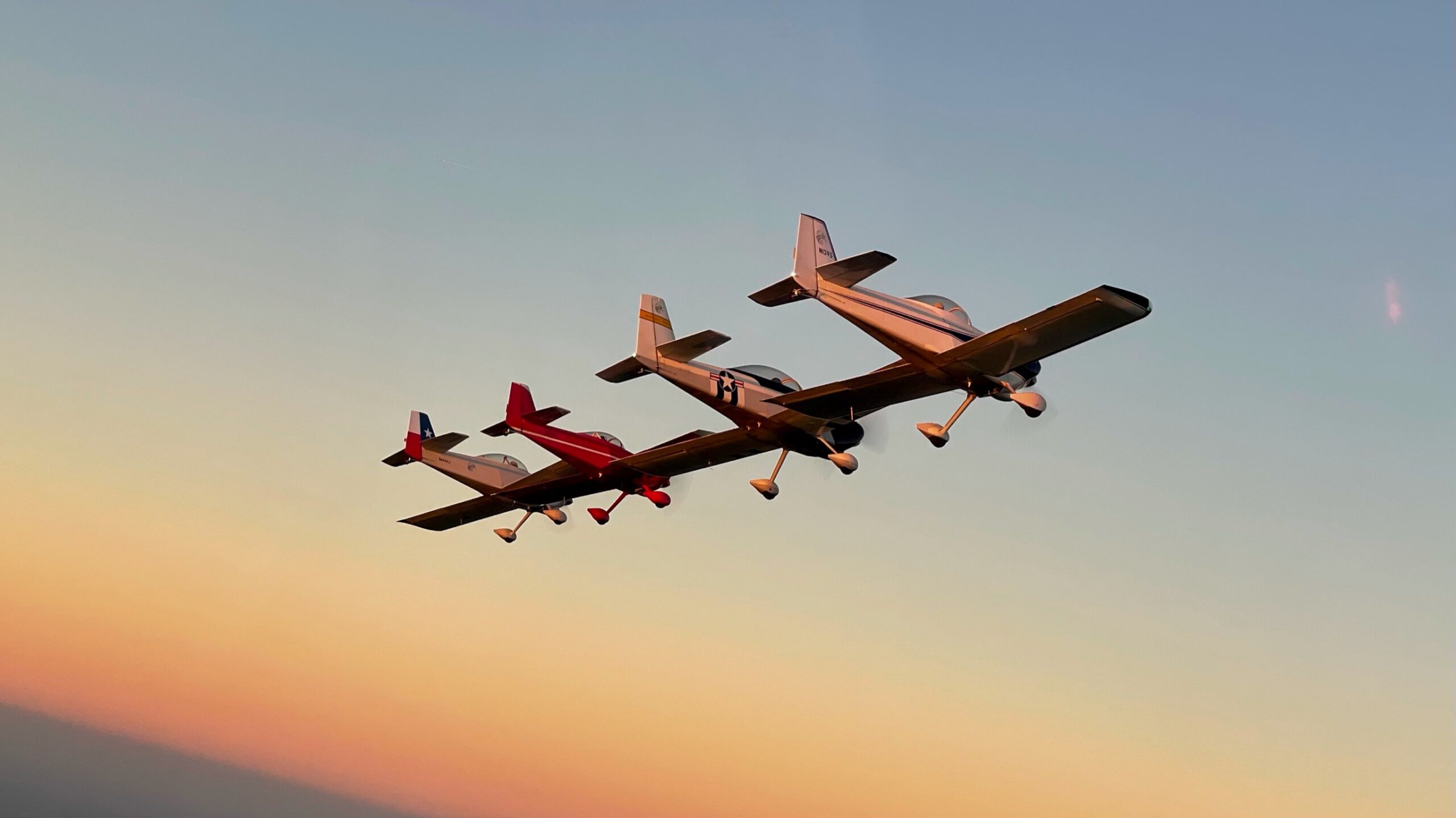 planes in formation at sunset