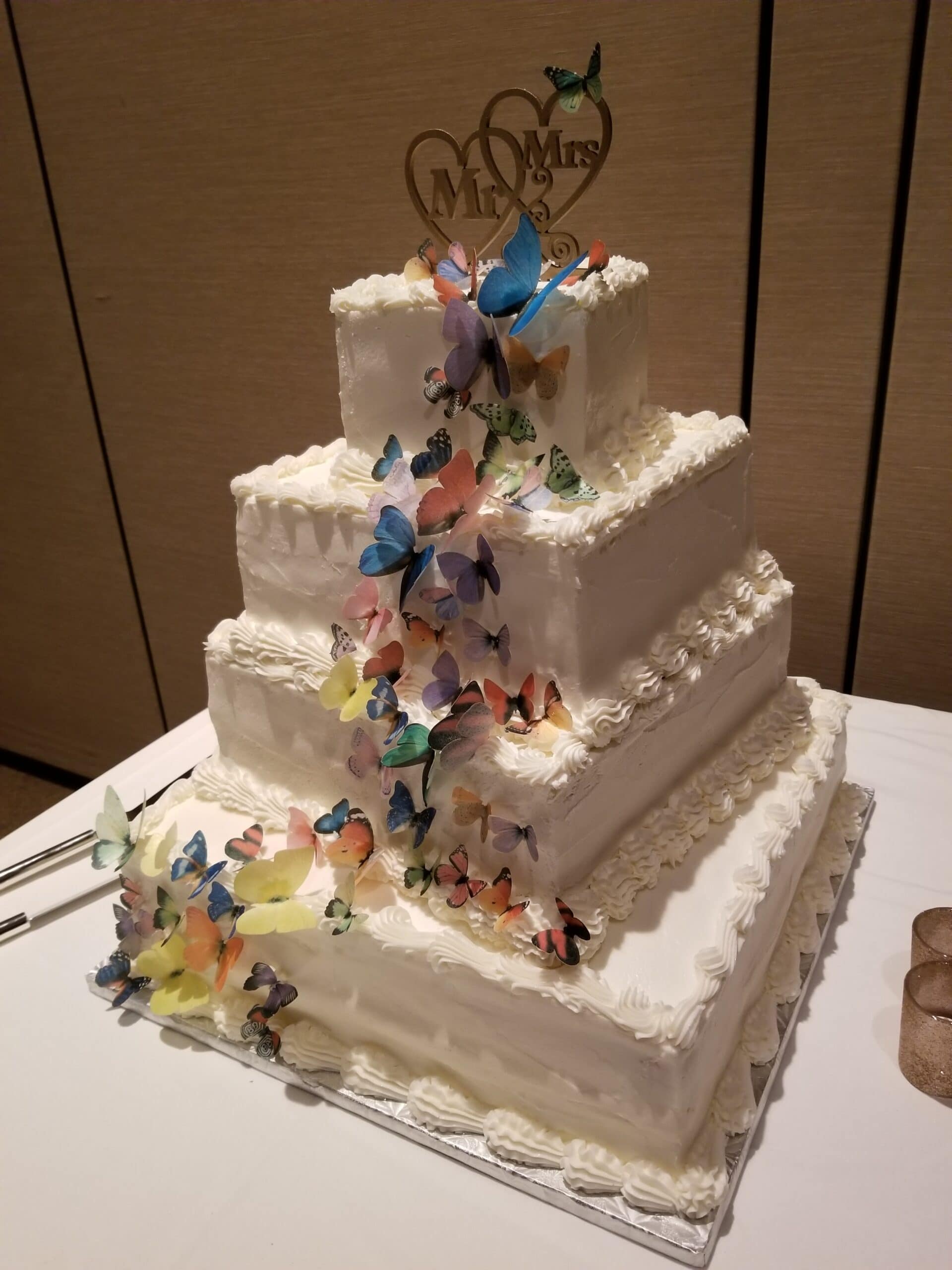 four tier wedding cake with flowers