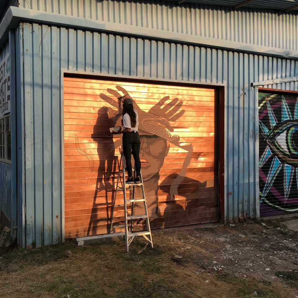 artist painting mural