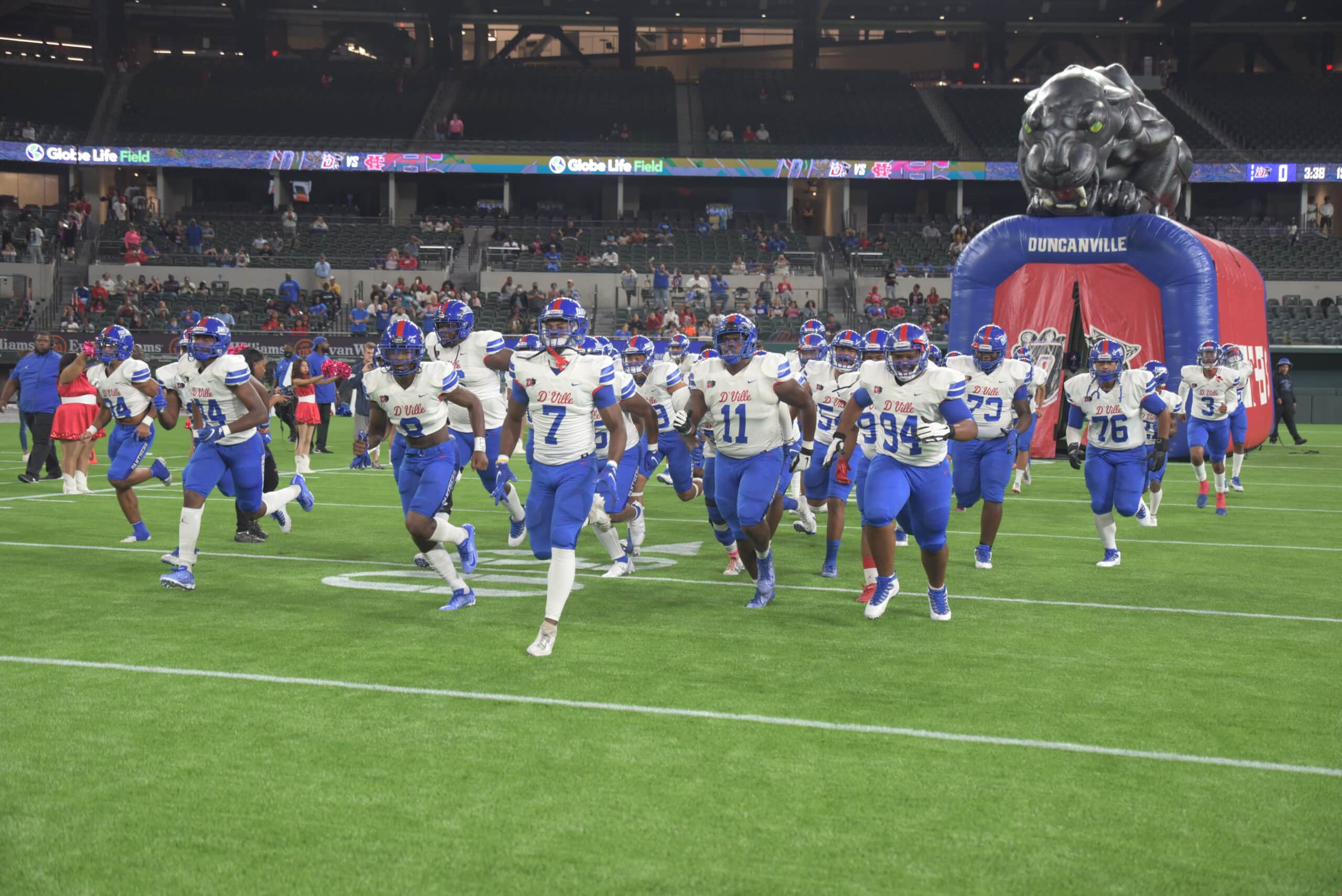 Duncanville football players running onto field