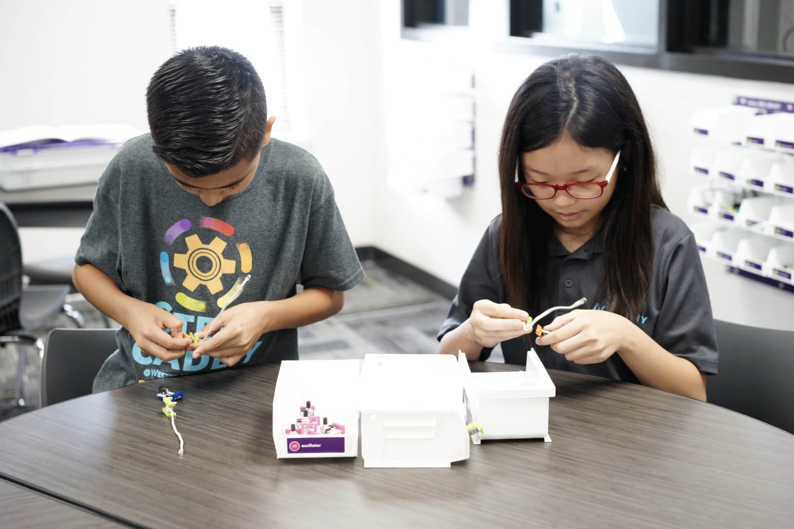 boy and girl working on craft