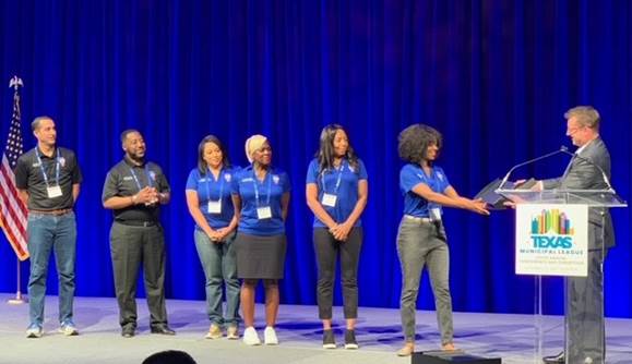 DeSoto officials standing on a stage