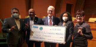 Waterford Oaks Playground Receives $20,000 From Atmos Energy group of people holding check
