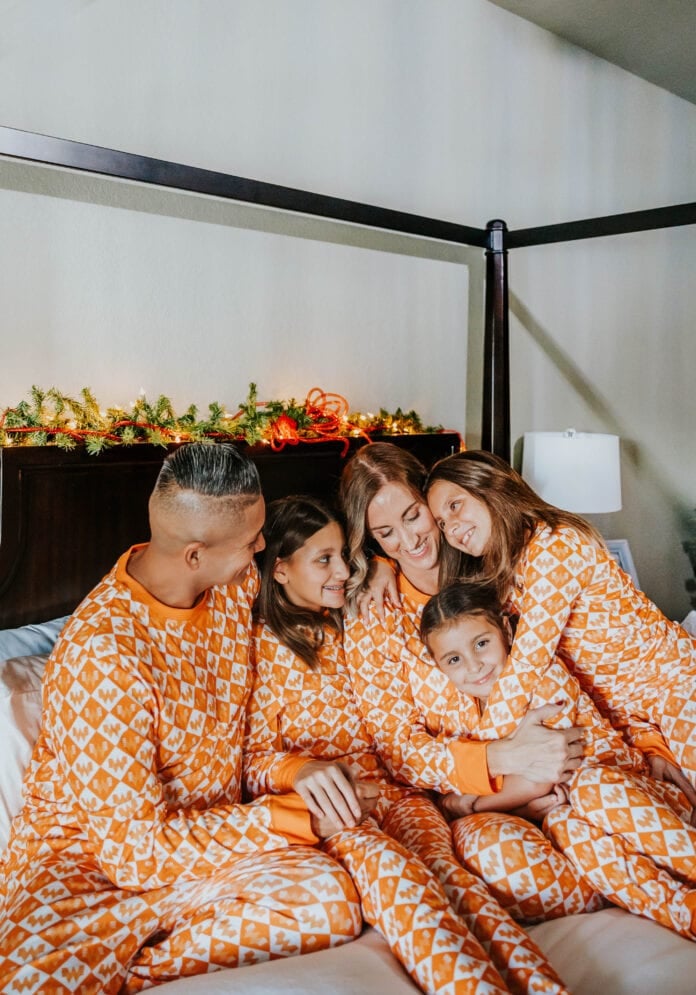 family wearing matching pajamas