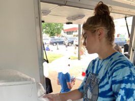 girl making a snowcone