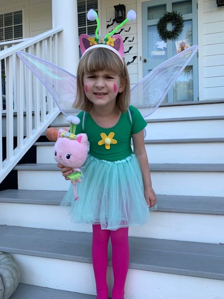 girl holding stuffed animal