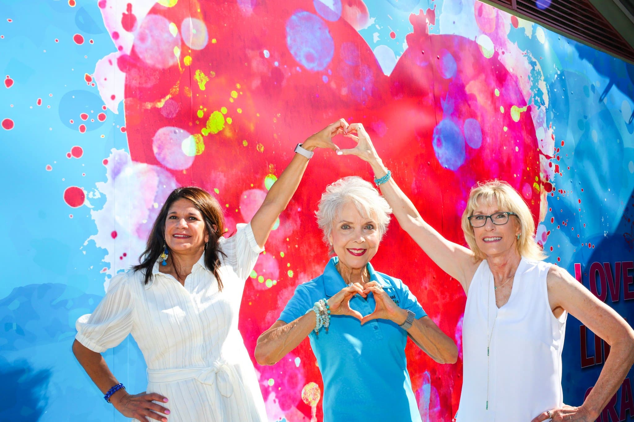 three ladies by heart mural