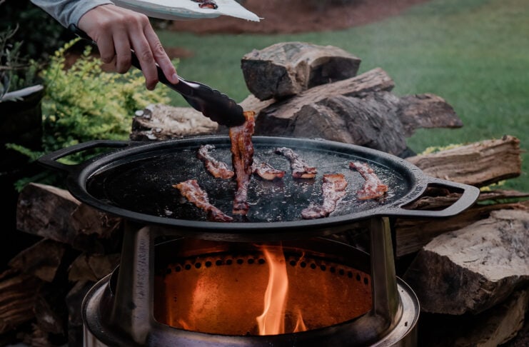 bacon cooking on griddl