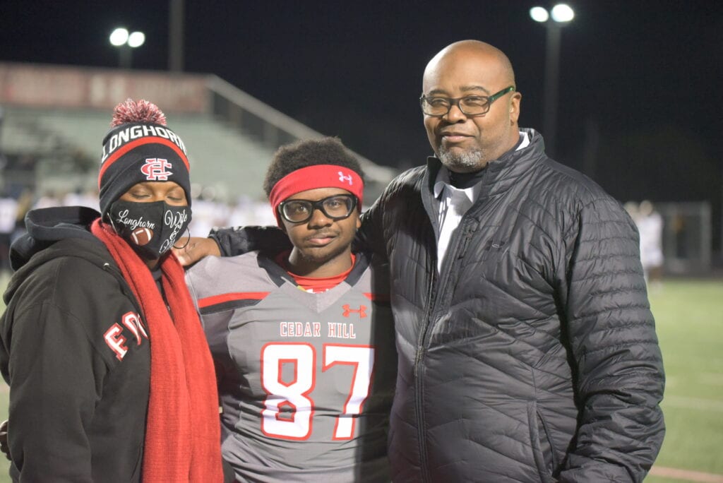 Coach Lynn with wife and son