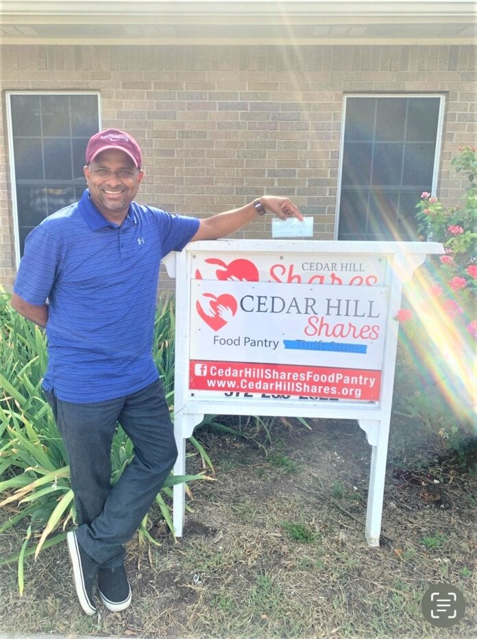 man standing by sign