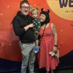 Happy Holiday Shopping Has Hit a Supply Chain Snag man and woman holding a child