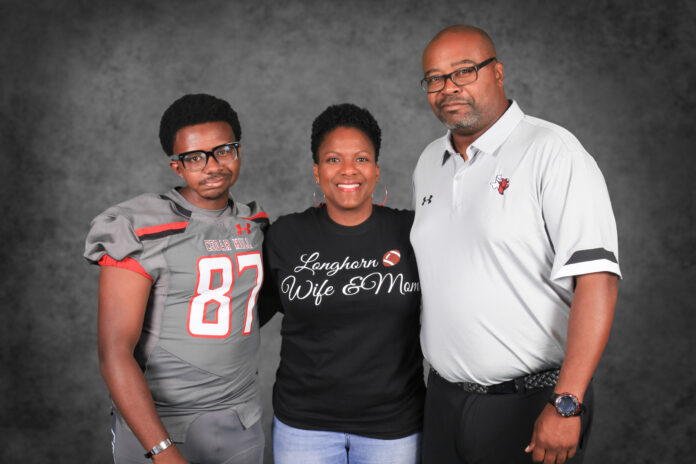 Cedar Hill Coach Lynn with wife and son