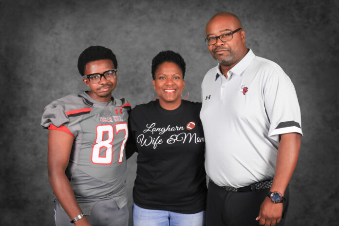 IMG_5207 Cedar Hill Coach Lynn with wife and son