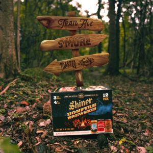 Shiner beer by trail signs