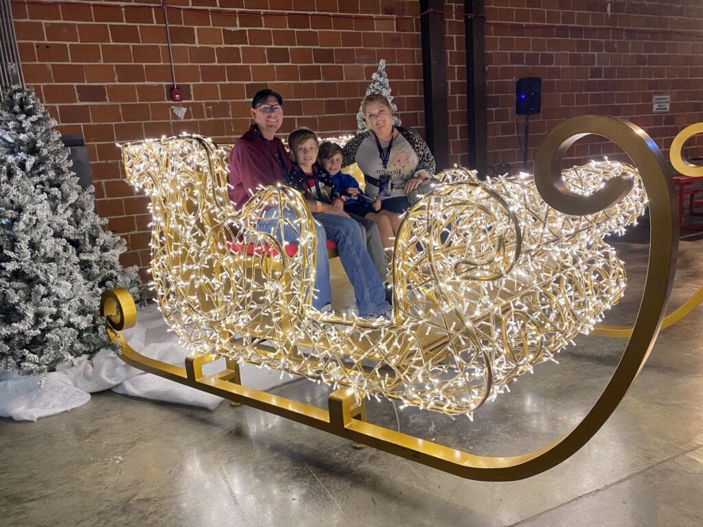 family sitting in sleigh 