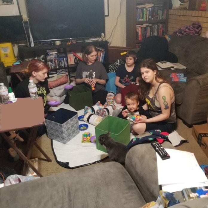 family sitting on floor