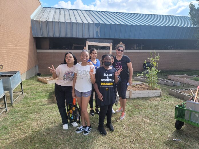 kids in front of school garden
