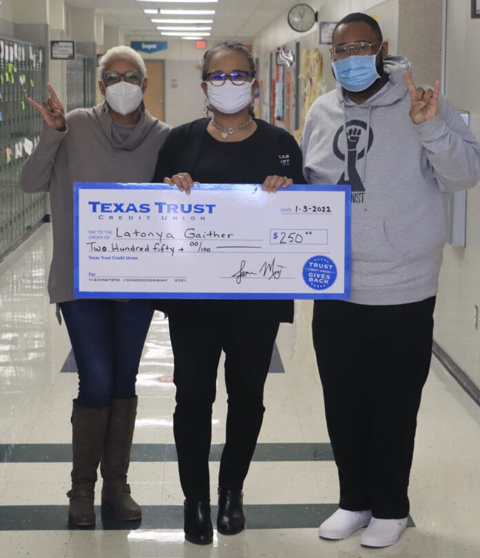 three adults with Texas Trust check