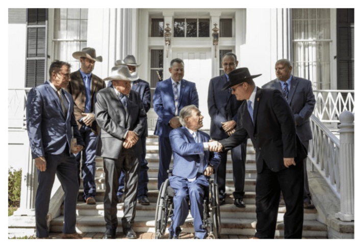 Governor Abbott shaking hands with man
