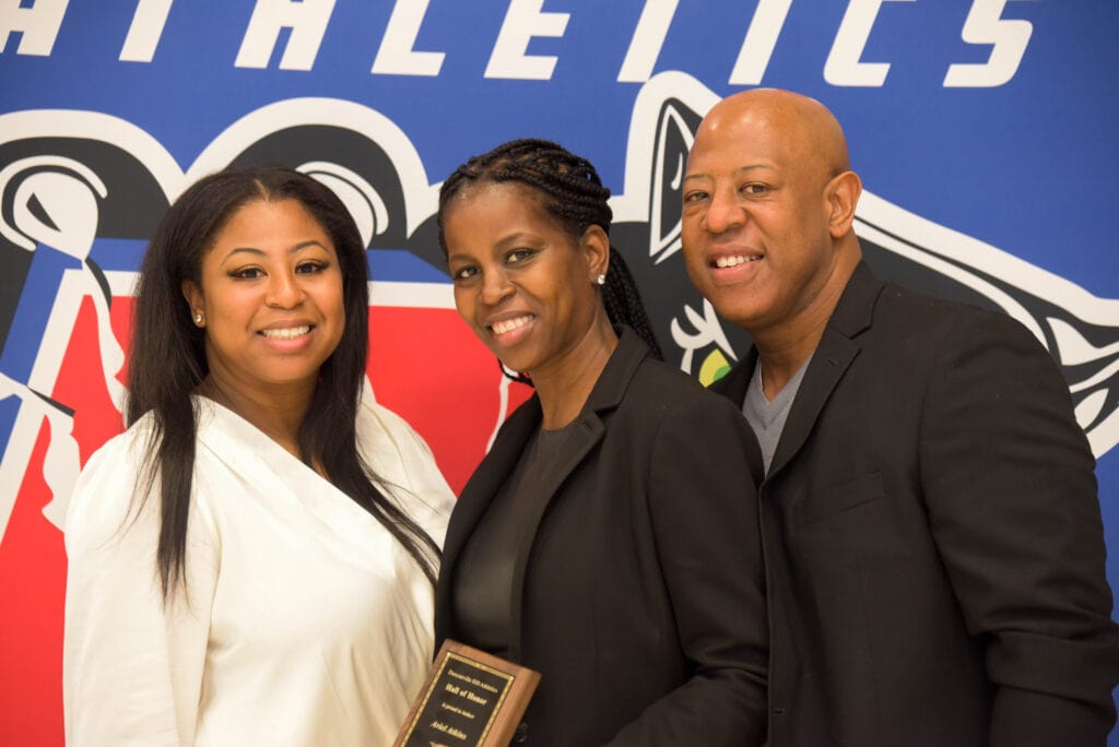 Ariel Atkins family accepts award