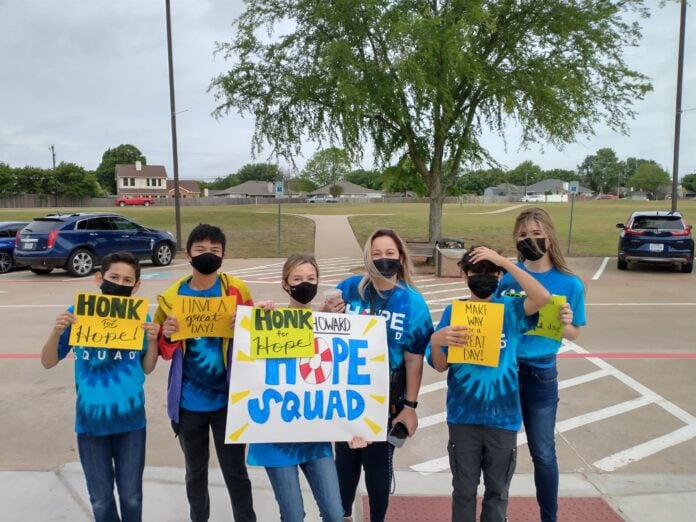 Students holding hope signs