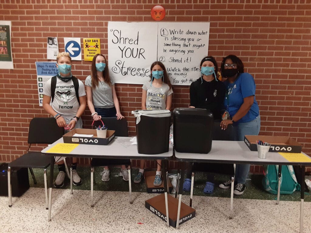 students behind a table