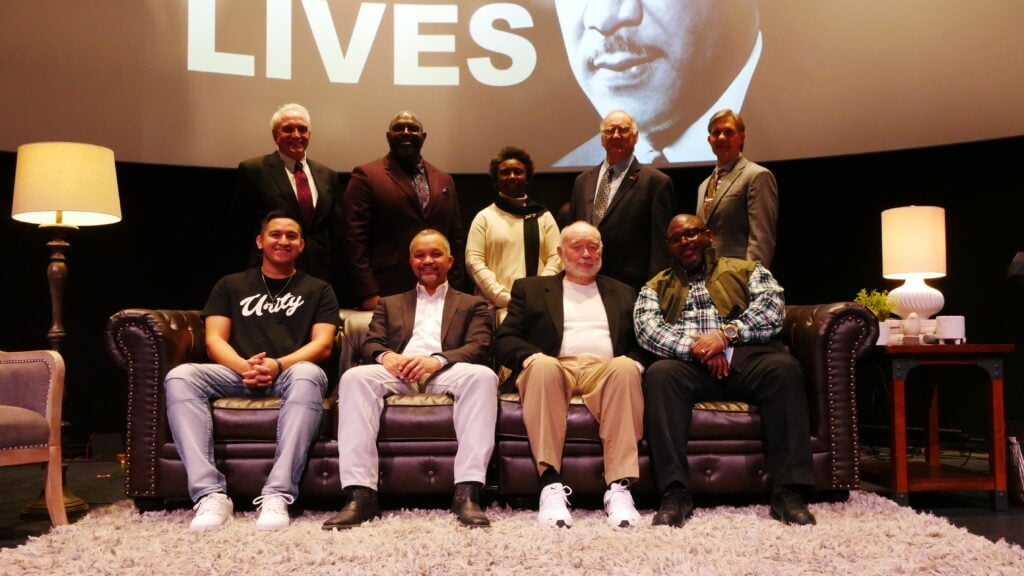 group of people in front of Martin Luther King poster