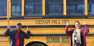Cedar Hill Citizens Enjoy Driving Buses For CHISD two people by school bus